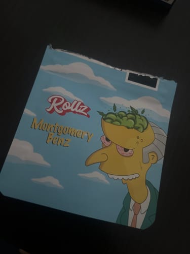 Reviewer's packaging for Montgomery Benz THCA Flower, showing a cartoon character with buds for a brain.