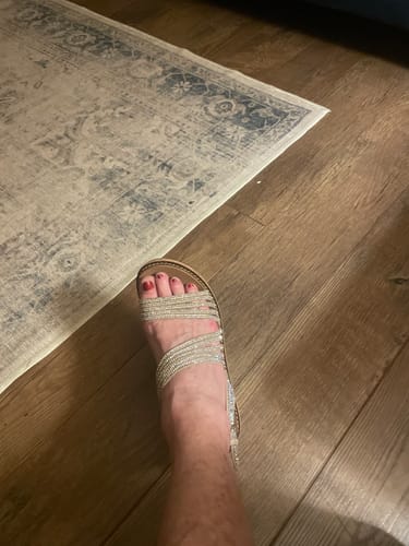 A customer's foot seen from above, wearing the sparkly Corky's Rhinestone About Last Night Wedges.