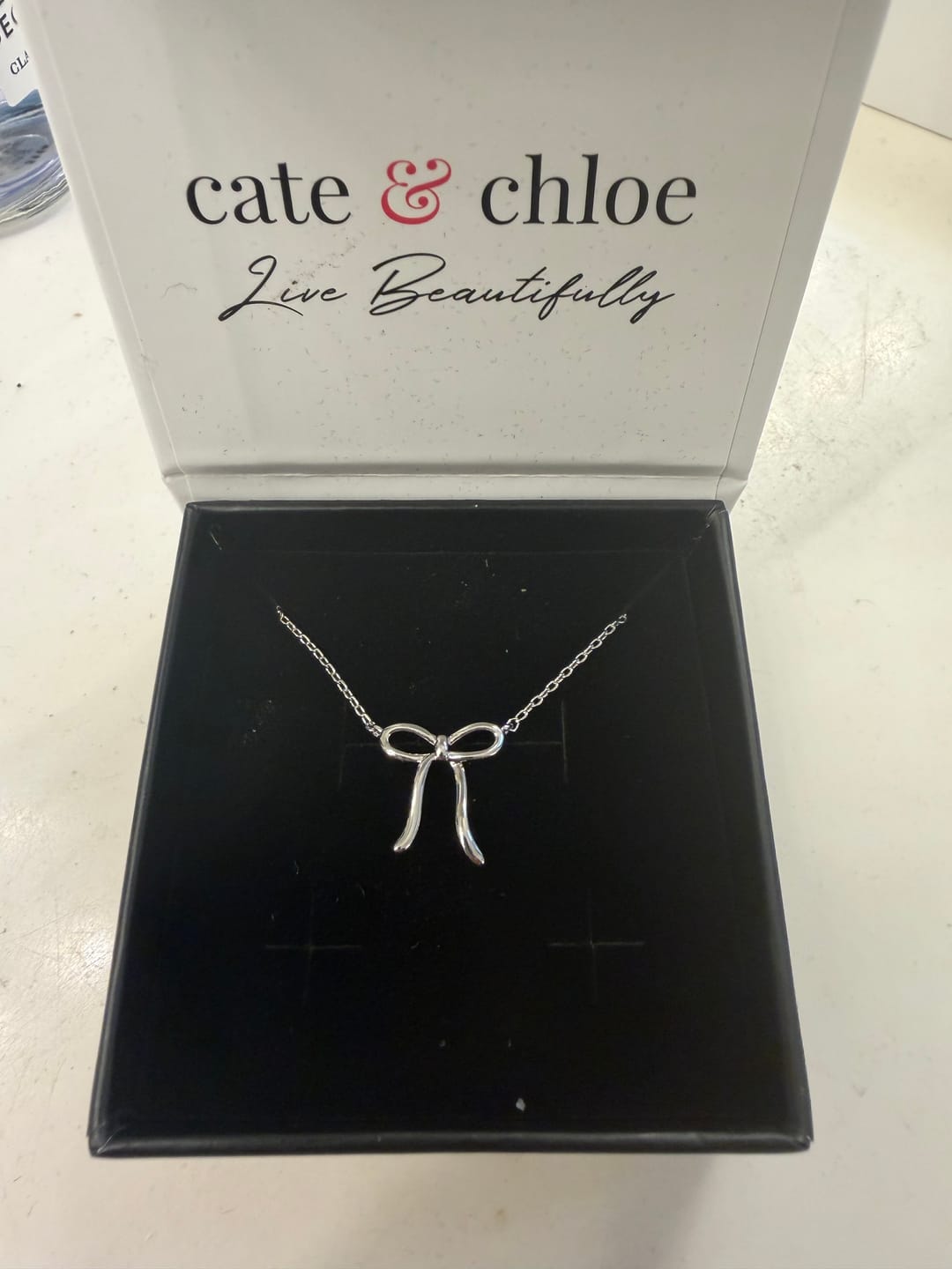 Customer photo review of Lola 18k White Gold Plated Ribbon/Bow Pendant Necklace