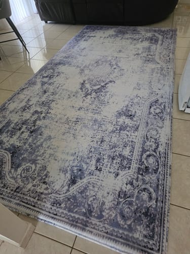 Customer's large Mellow Mat with the Frosthaven print laid out on a tiled floor in a living room.