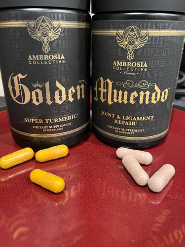 Reviewer's Momentum Stack showing the Golden bottle with yellow capsules and the Mwendo bottle with white capsules.