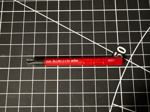 Customer's red Wiha Tools Insulated SlimLine Blade with a Xeno #2 tip, shown on a black gridded mat.