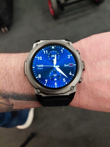 Reviewer's Gard Pro Ultra 3 watch on their wrist, showing its rugged silver case and a bright blue digital face.
