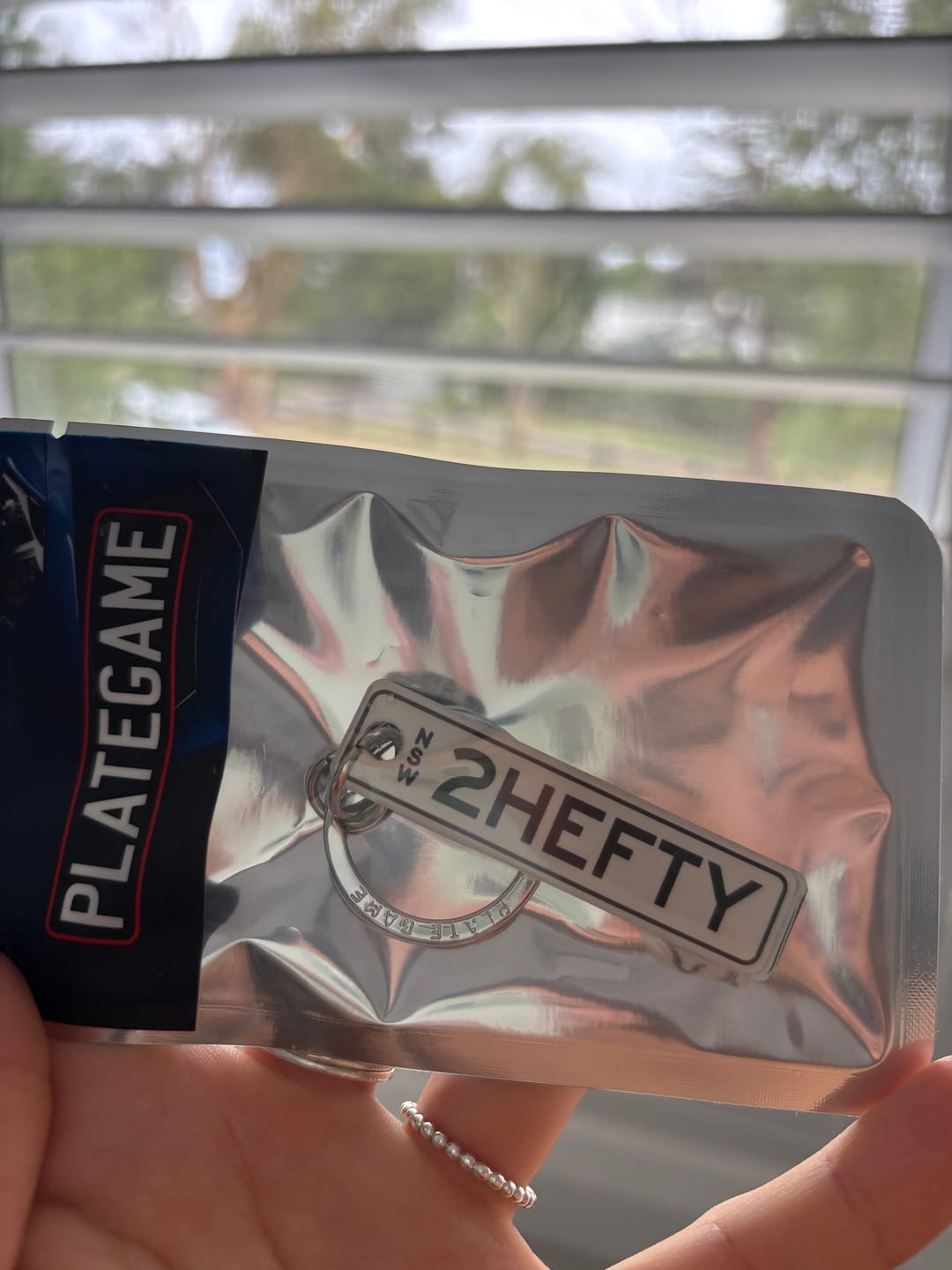 Customer photo review of NSW Colour on White Licence Plate Custom Keychain