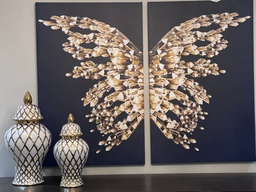 Customer's elegant Gold & White Ginger Jars, in two sizes, displayed on a dark surface in their home.