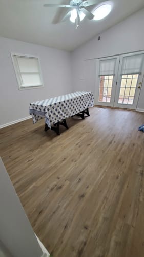 Reviewer's new Full Lite Frame Kit with 15 Grids installed on one of two French doors in a room.