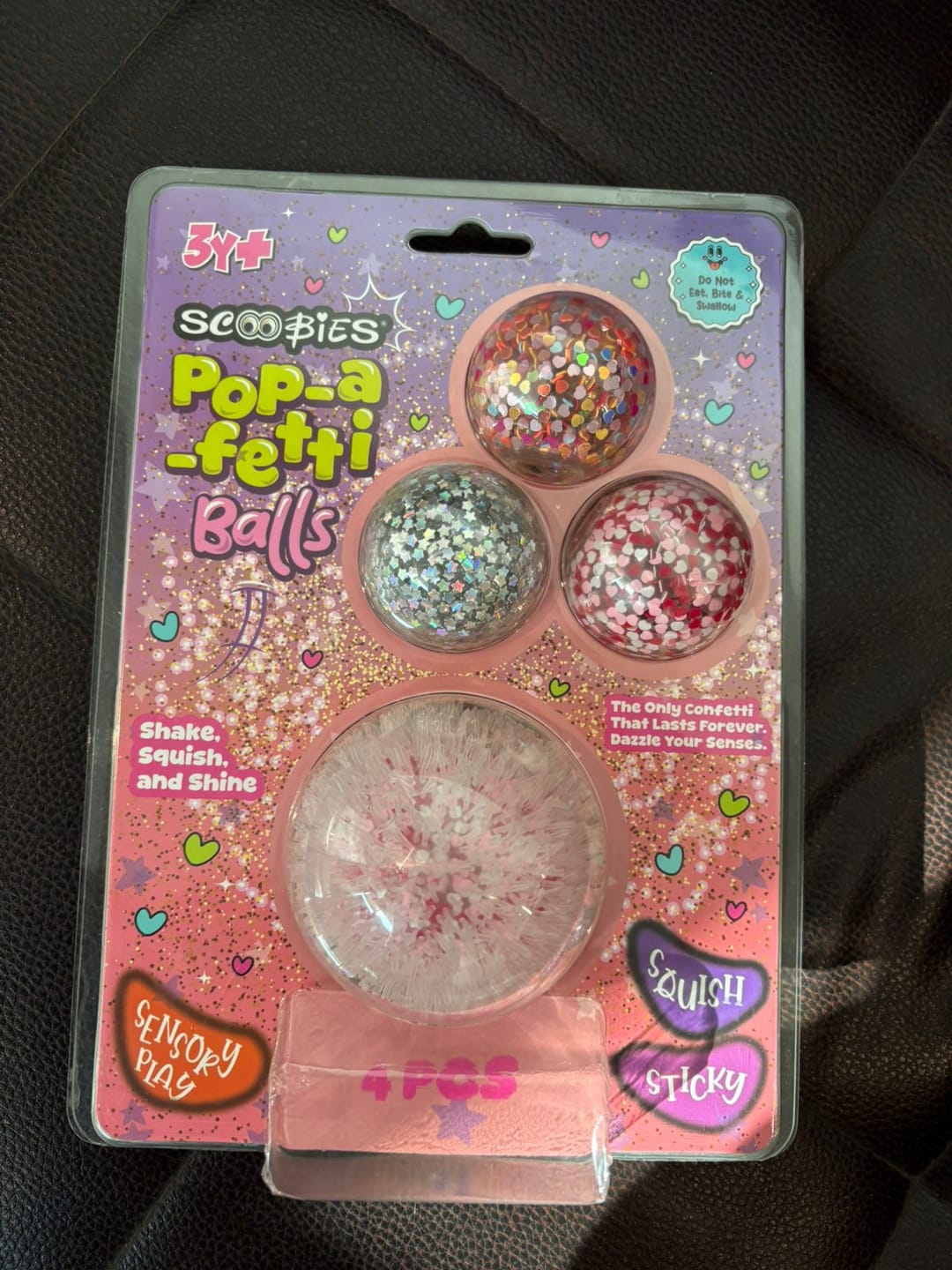 Customer photo review of Scoobies Pop-a-fetti Balls: 3 Confetti Squishy + 1 Fuzzy Spiky Sensory Ball (Set of 4)| (Pink, Silver, Red & Multicolor) Stress Relief & Sensory Play | Shake, Squish & Shine | Sticky, Squishy & Sparkly Fun for Kids & Adults