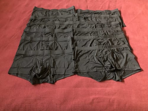 Customer's collection of black Nylon 3in Boxer Briefs laid out neatly in two columns.