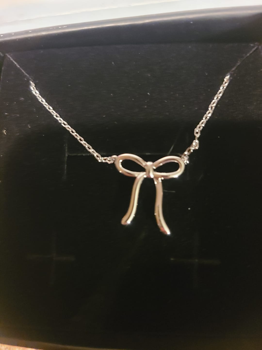 Customer photo review of Lola 18k White Gold Plated Ribbon/Bow Pendant Necklace