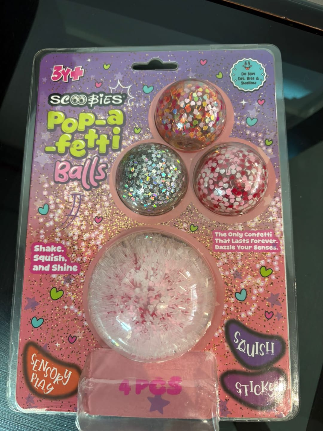 Customer photo review of Scoobies Pop-a-fetti Balls: 3 Confetti Squishy + 1 Fuzzy Spiky Sensory Ball (Set of 4)| (Pink, Silver, Red & Multicolor) Stress Relief & Sensory Play | Shake, Squish & Shine | Sticky, Squishy & Sparkly Fun for Kids & Adults
