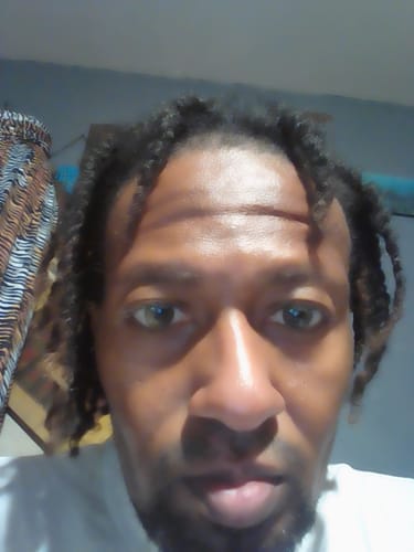 Reviewer in a close-up photo, showing off their natural-looking Yari Gray contact lenses.