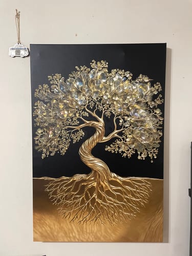 Customer's 3D Tree of Life wall art with a textured gold trunk and crystal leaves, hanging on a light-colored wall.
