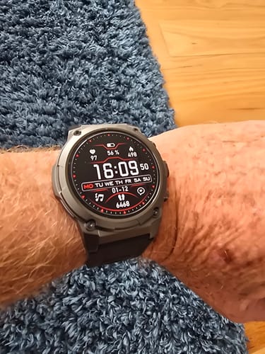 Close-up of a reviewer wearing the Gard Pro Ultra 3 smartwatch on their wrist, showing the active digital face.