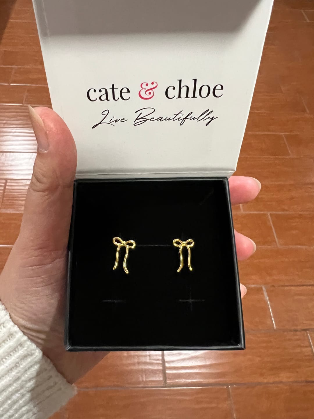 Customer photo review of Lola 18k White Gold Plated Ribbon/Bow Drop Earrings