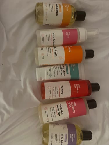 Customer's products from the Bright & Even Skin Kit and other body care items displayed on a white surface.