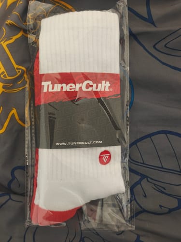 Customer's Moonstone Crew Socks shown in their original clear packaging.