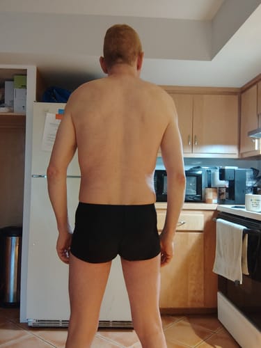 Reviewer showing the back view of the black Nylon 3in Boxer Briefs.