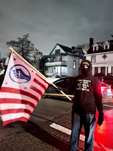 Customer photo review of Immigrants Premium Unisex T-Shirt