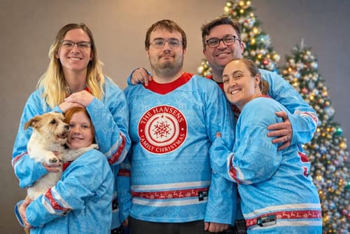 Reviewer and family wearing matching light blue Family Christmas Custom Hockey Jerseys.