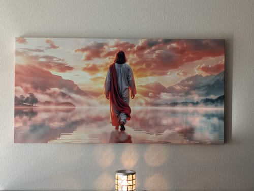 Reviewer's panoramic canvas print of Jesus with a red sash walking on misty water toward a sunset over mountains.