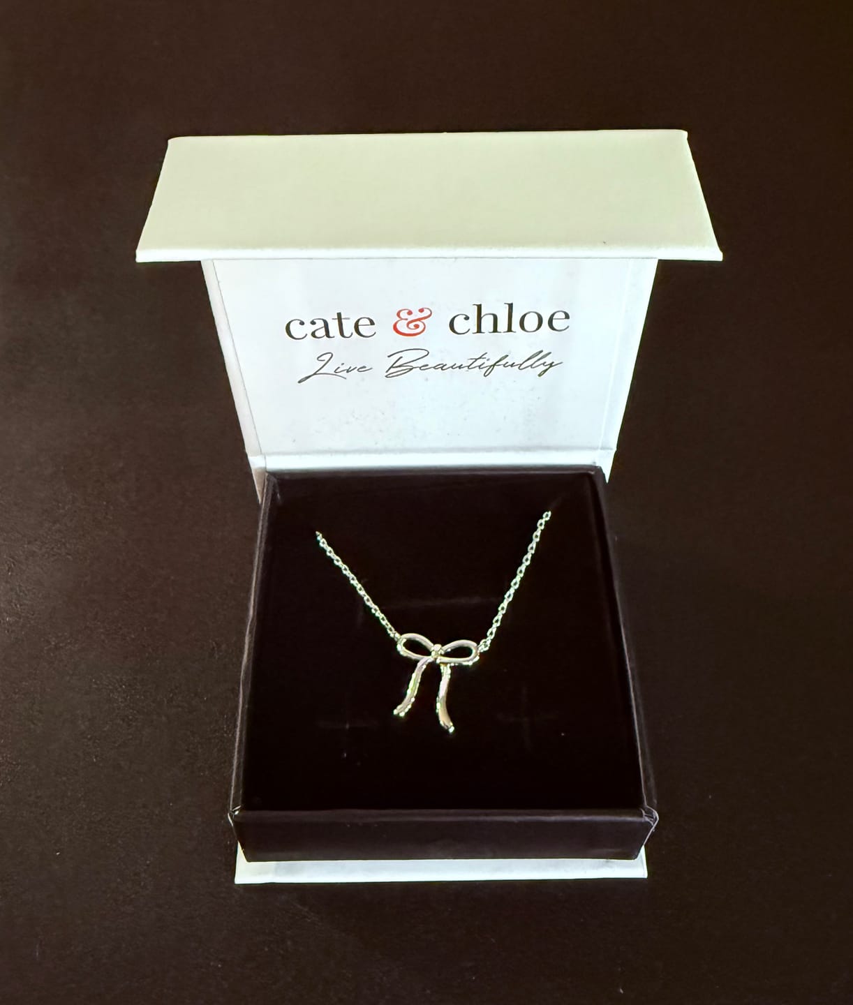 Customer photo review of Lola 18k White Gold Plated Ribbon/Bow Pendant Necklace