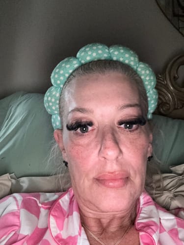 Customer's close-up selfie showing shiny skin results after their Professional Skin Scan.