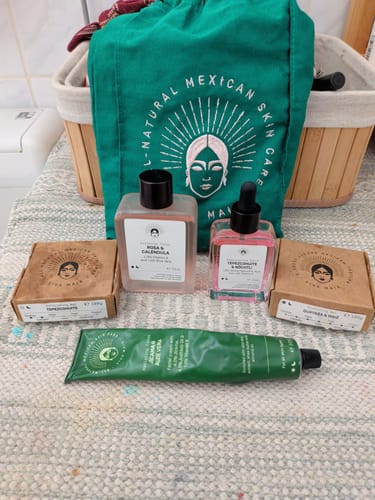 Reviewer's Barrier Protection Routine products, including a green tube and pink bottles, arranged with their packaging.