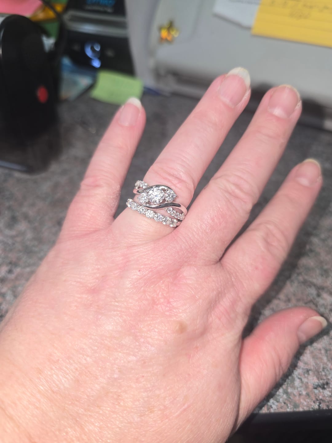 Customer photo review of Swirl Three Stone Moissanite Twisted Pave Engagement Ring