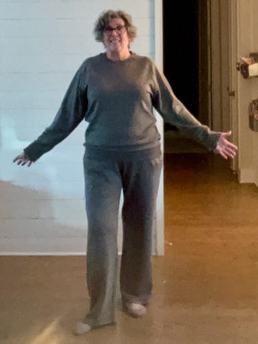 Reviewer standing indoors wearing the Bailey Crewneck Sweatshirt in Arctic Dusk with matching pants.