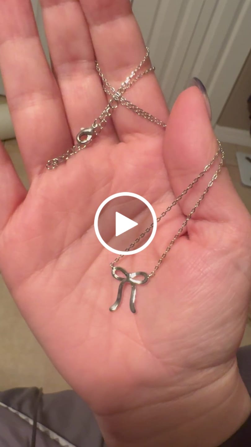 Customer video review of Lola 18k White Gold Plated Ribbon/Bow Pendant Necklace