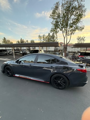 Customer photo review of Fit 2025-2027 Toyota Camry Side Body Skirts Gloss Black with Red Trim