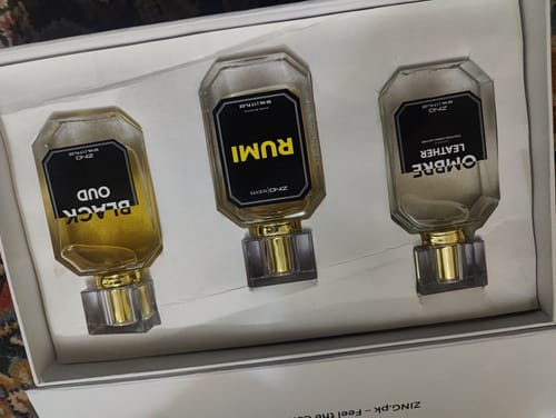 Customer's OUD Supreme BUNDLE showing three fragrance bottles with black labels in a white box.