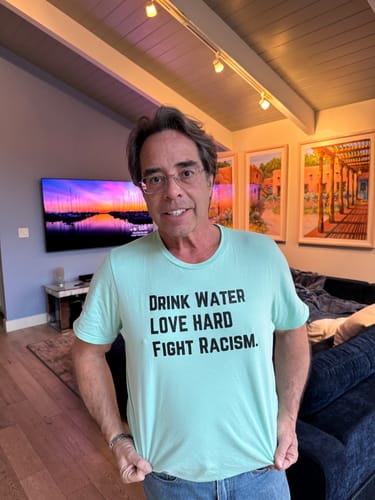 Customer photo review of Drink Water Fight Racism Unisex T-shirt