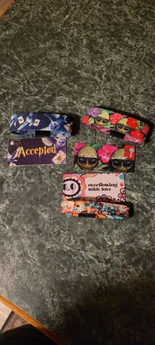 Customer's Magical Mystery 3-Pack laid out on a counter, showing three different colorful wristbands and their cards.