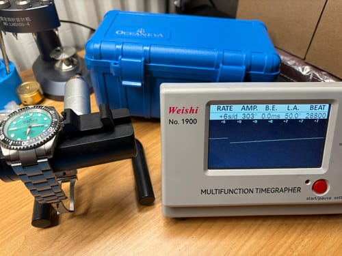Reviewer's Oceaneva Deep Marine Explorer II watch on a timegrapher machine, with its performance metrics displayed on screen.