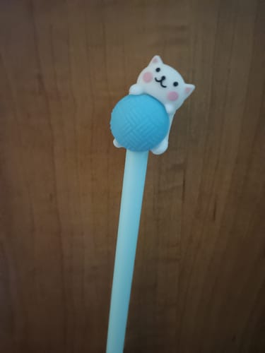 A customer's light blue Purr-fectly Yarn-tangled Cat Gel Pen, showing the cute cat and yarn topper.