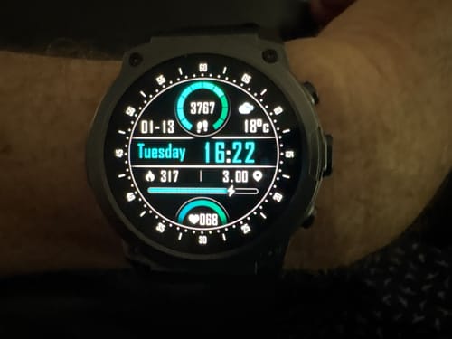Close-up of a customer's Gard Pro Ultra 3 smartwatch on their wrist, showing the bright digital face with fitness data.