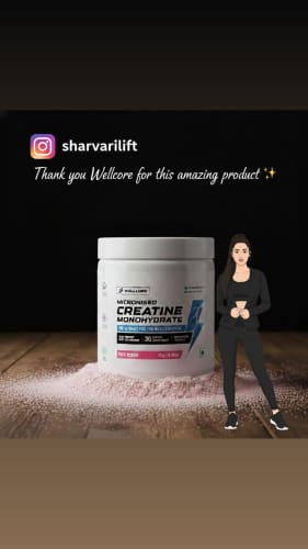 Reviewer's social media post showing the Wellcore Creatine Monohydrate tub with pink powder on a wooden surface.