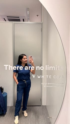 Customer photo review of 4-Pocket MoveTech® Scrub Top - Women / Navy