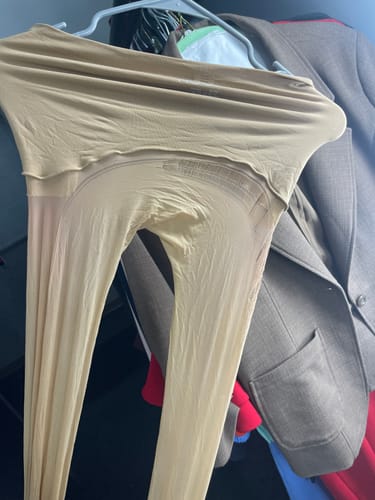 Customer's sheer Free Hugging Seamless Tights hanging from a hanger.