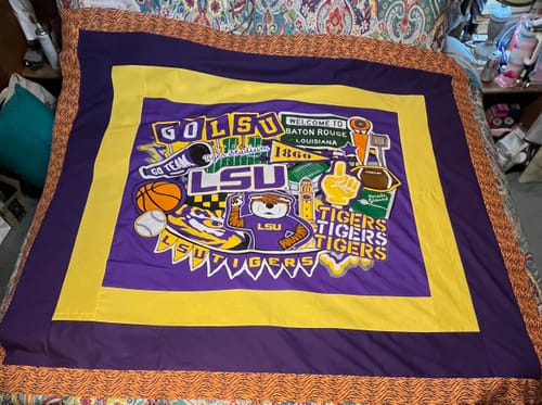 Customer's quilt in progress, using the Animal Stripes Fabric as the outer border for an LSU-themed design.
