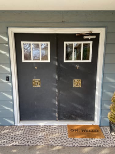 Customer's Clear 3 Lite Glass and Frame Kit installed on a set of custom black double doors.