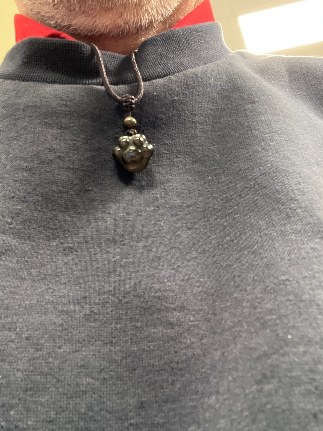 Customer photo review of Pendentif Patte "Lien Éternel" en Obsidienne Dorée