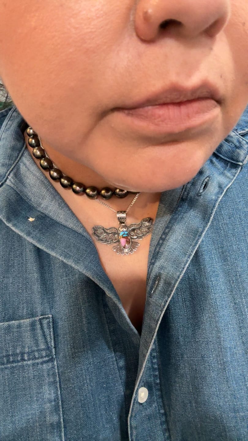 Customer photo review of Artisan Made Dahlia Bird Pendant | 925 Sterling Silver