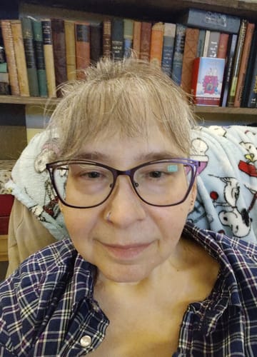 Customer selfie showing their face and smooth lips in a review for Neptune Tallow & Manuka Honey Lip Balm.