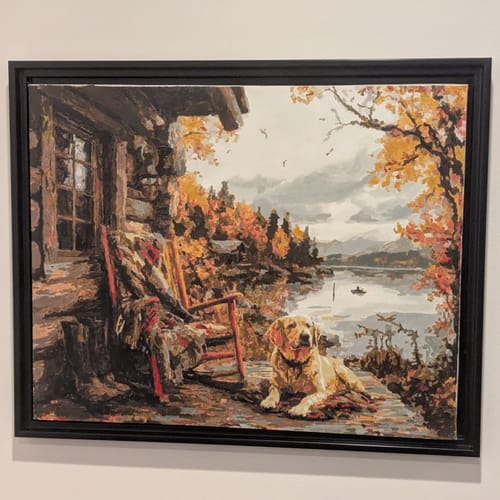 Customer's completed and framed 'The Loyal Rest' paint-by-numbers, featuring a dog on a porch.