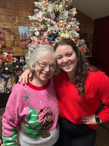 Customer and a loved one smiling and hugging, showing the emotion behind the Hug Ring gift.