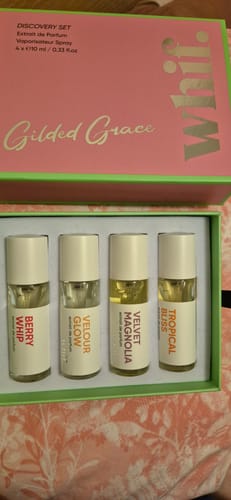 Customer's 'Gilded Grace' Discovery Set in its open box, showing the four small perfume bottles.