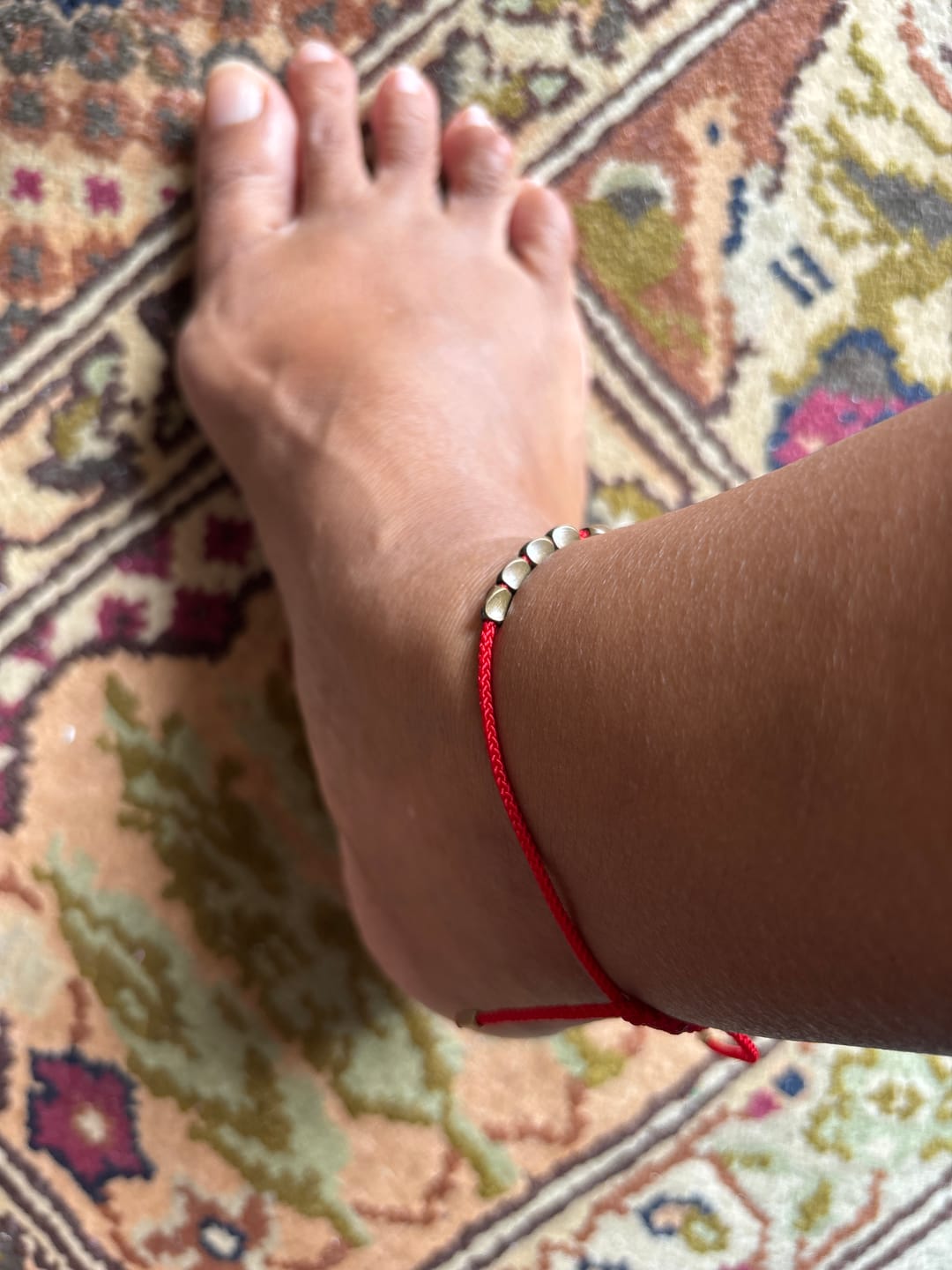 Customer photo review of Tibetan Red String Bracelet with Copper Beads – Handmade Unisex Protection & Good Luck Jewelry