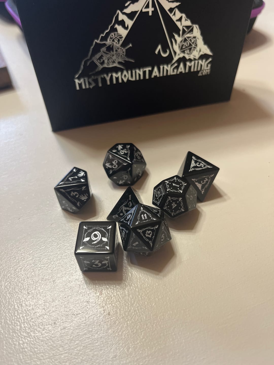 Customer photo review of Fangs of Winter Obsidian Stone Dice Set